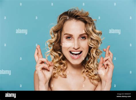 Beauty Image Of Joyful Half Naked Woman With Curly Hair Smiling And Keeping Fingers Crossed
