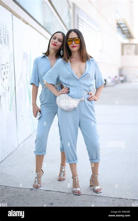 Daria Vasilieva and Maria Vasilieva posing on the street during ...