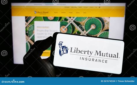 Person Holding Mobile Phone With Logo Of American Insurance Company Liberty Mutual Group On