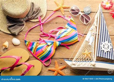 Beauty Colorful Bikini And Accessories On Wooden Floor For Trip Stock