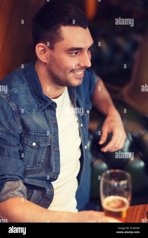 Happy Man Drinking Beer At Bar Or Pub Stock Photo Alamy