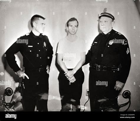 Lee Harvey Oswald and two policemen - taken after Oswald's arrest 1963 ...