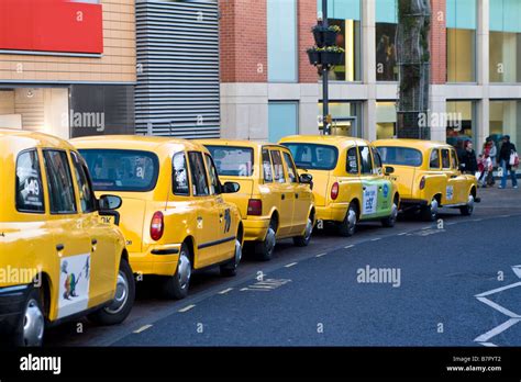 A rank of Yellow taxi cabs Stock Photo - Alamy