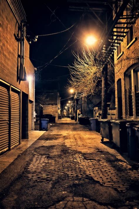 Dark Empty And Scary Urban City Street Alley At Night Stock Image