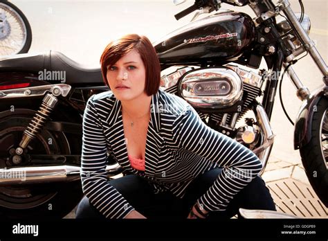 Young girl with Harley Davidson motorcycle Stock Photo - Alamy