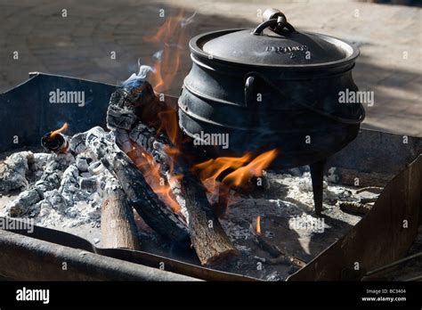 Cooking on an open fire with a cast iron pot. A cast iron pot is used ...