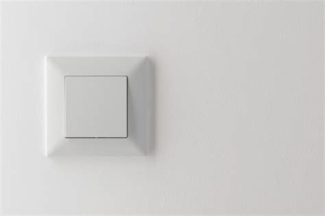 Premium Photo | Light switch on wall