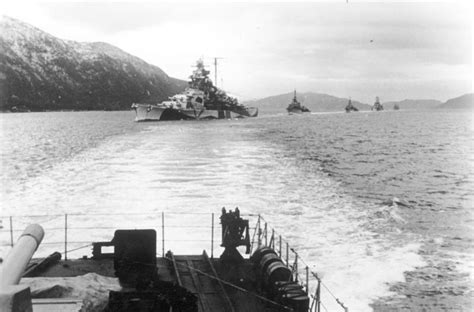 German battleship Tirpitz, escorted by several destroyers, steaming in the Bogenfjord in October ...