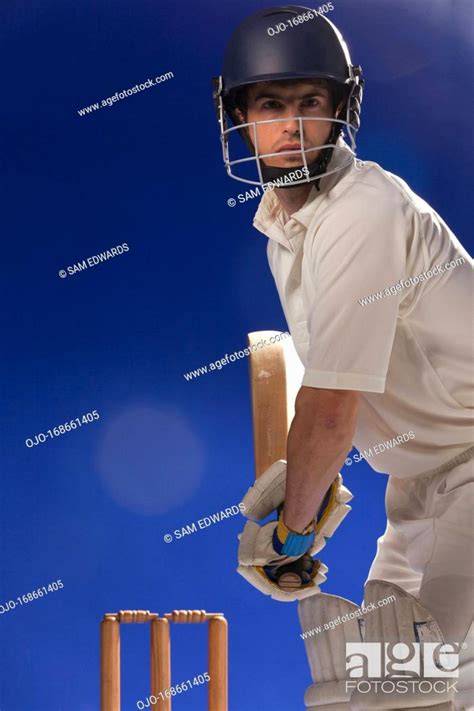 Cricket Player Holding Bat Stock Photo Picture And Royalty Free Image