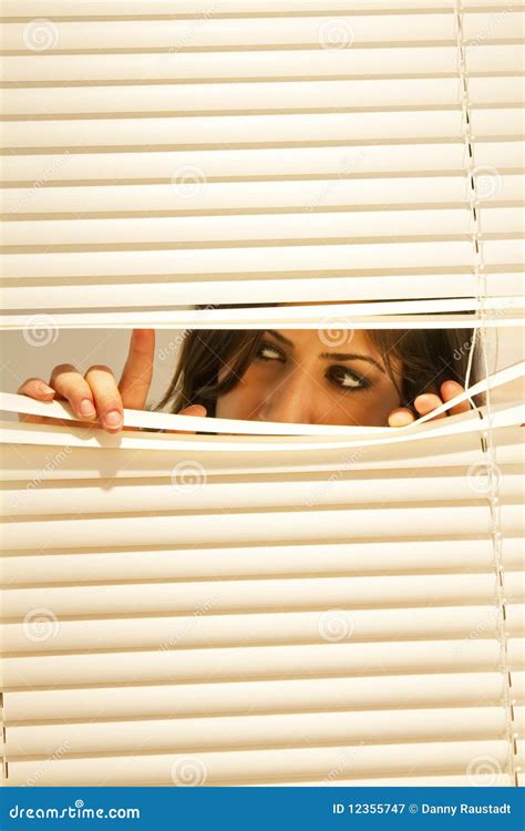 Young Brunette Woman Looking Through Window Blinds Stock Image Image