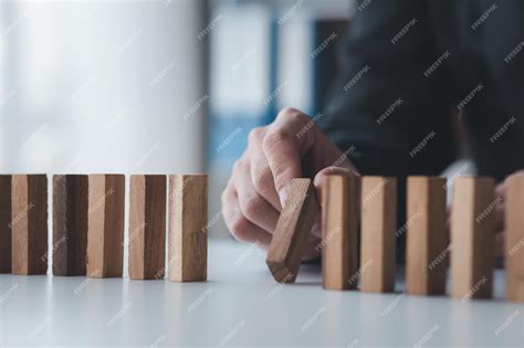 Premium Photo A Closeup Shot Of A Businessman Holding The Wooden