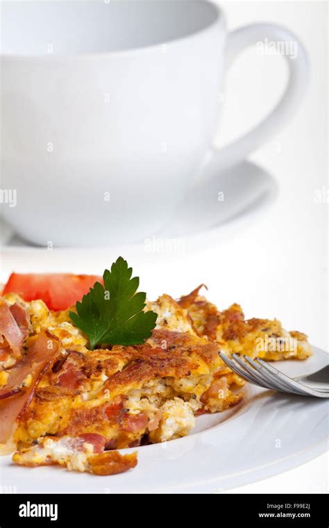 Scrambled Eggs And Bun On A Plate Isolated On White Stock Photo Alamy