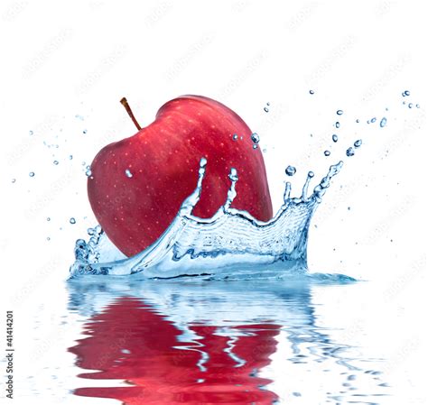 Red Apple Falling Into Water Isolated On White Background Stock Photo