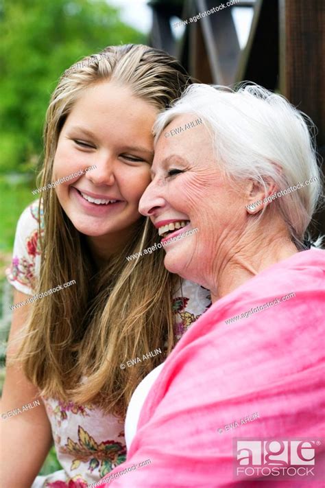 Grandmother And Granddaughter Smiling Stock Photo Picture And Royalty