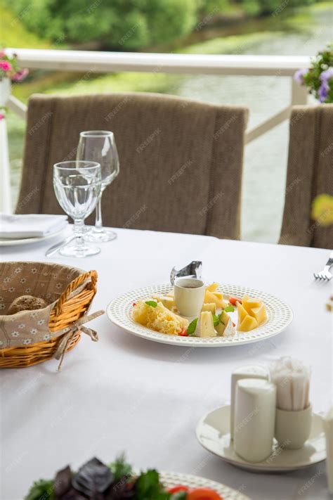 Premium Photo | White table woth restaurant ingredient food includes a