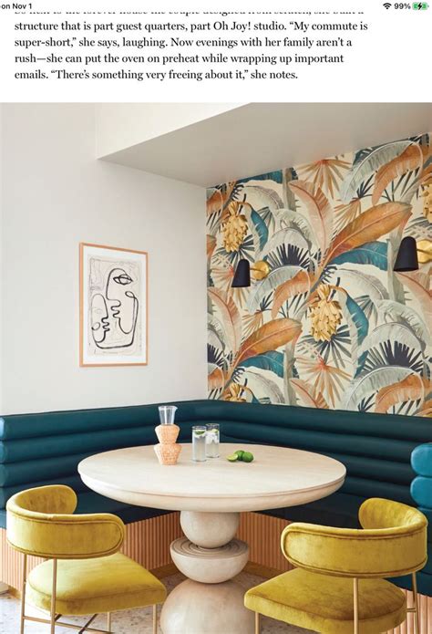 The Inside Of A Restaurant With Yellow Chairs And A White Table In