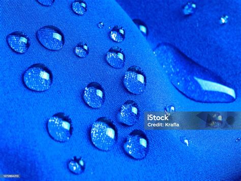 Blue Waterproof Fabric With Raindrops Close Up Stock Photo Download