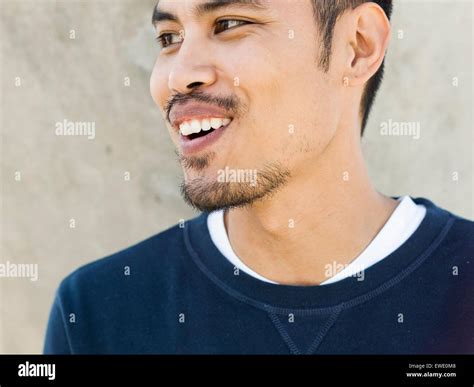 Portrait Of A Smiling Young Man Asian Mixed Race Stubble Beard Looking