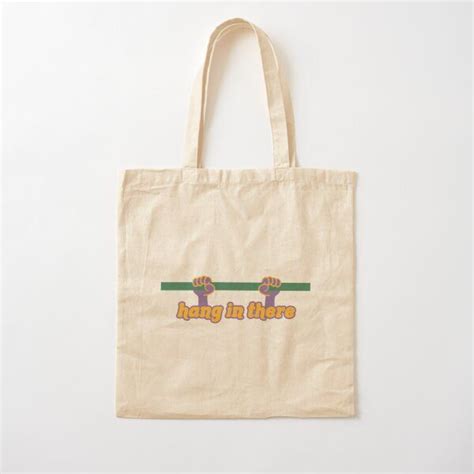 A Tote Bag With The Word Love Written In Rainbow Colors On It And A