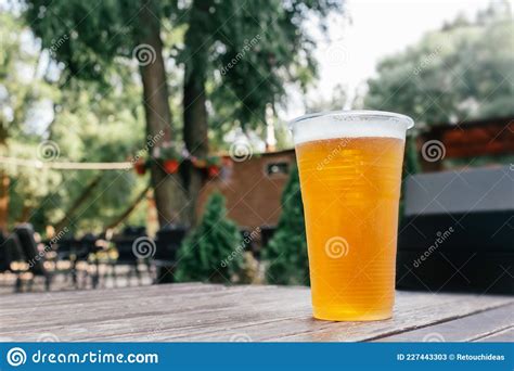 Light Beer In Glass On Wooden Table Stock Image Image Of Golden Closeup 227443303