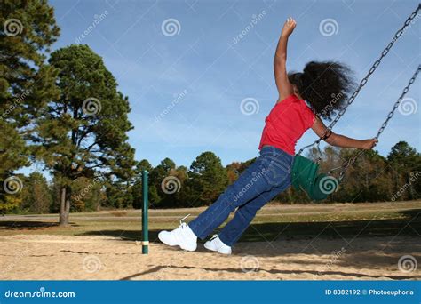 Girl jumping off swing stock photo. Image of carefree - 8382192