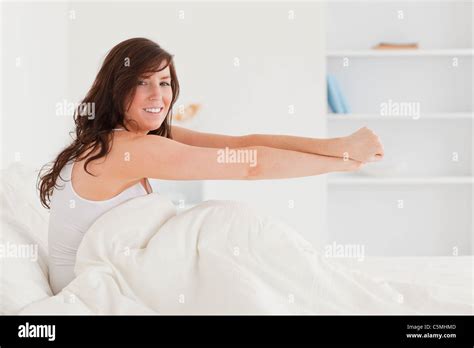 Beautiful Brunette Female Posing While Stretching Stock Photo Alamy