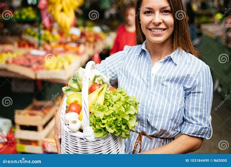 Portrait Of Beautiful Woman Holding Shopping Basket Stock Photo Image