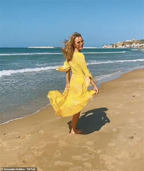 Amanda Holden Shows Off Her Incredible Figure In A Yellow Bikini As She Soaks Up The Sicilian