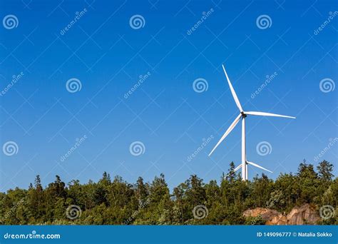 Windmills In The Blue Sky Background Stock Photo