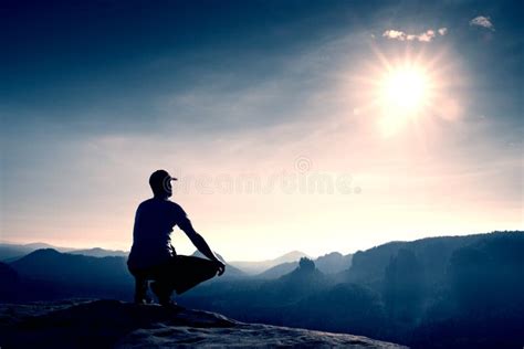 Man Squatting In The Bushes Stock Photo Image Of White Dark