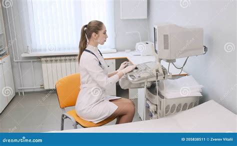 Portrait A Girl Doctor Conducts An Analysis On An Ultrasound