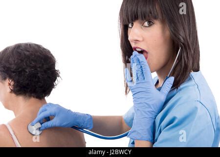 Woman Doctor Examines Nude Female Patient With Stethoscope Held To Back Stock Photo Alamy