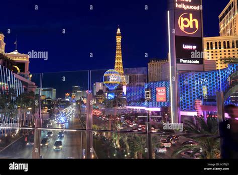 Night view of Las Vegas Strip with the replica of Eiffel Tower of Paris Las Vegas Hotel in the ...