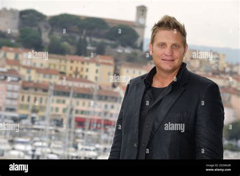 South African Singer Kurt Darren Poses For A Photocall During The Midem