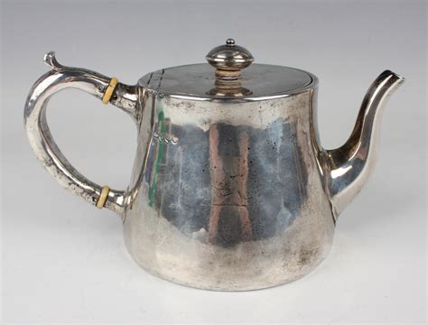 An Early Victorian Silver Teapot Of Low Bellied Cylindrical Form The