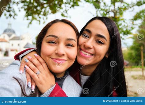 Happy Latin Lesbian Couple Hugging Taking A Selfie At Street Stock Photo Image Of Lesbian