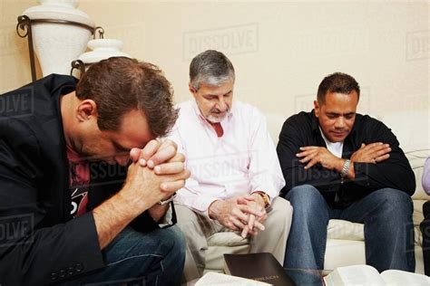 Men Praying Together Stock Photo Dissolve