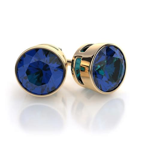 Bezel Set Blue Sapphire Gemstone Stud Earrings In 14k Yellow Gold In