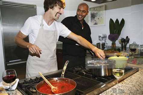 Two Men Cooking Dinner In Kitchen High Res Stock Photo Getty Images