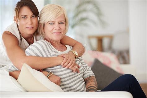 Portrait Hug And Lesbian Couple Relax In Home Together For Love Support And Care Face Lgbtq