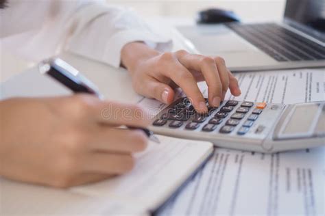 Asian Businessmen Work With Calculators To Calculate Account