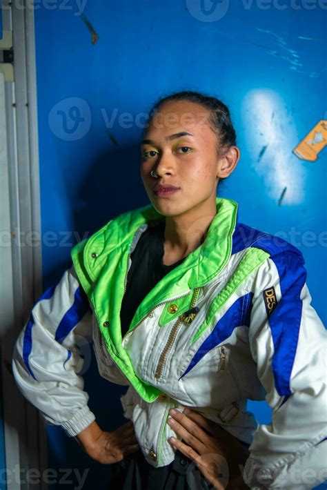 A Gay Asian Man Posing Beautifully Against A Blue Background 28769288 Stock Photo At Vecteezy