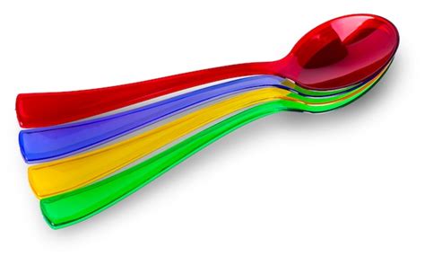 Premium Photo Colored Plastic Spoons On White