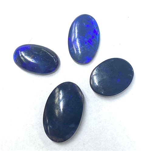 Lot Four Oval Black Opal Gemstones Ct