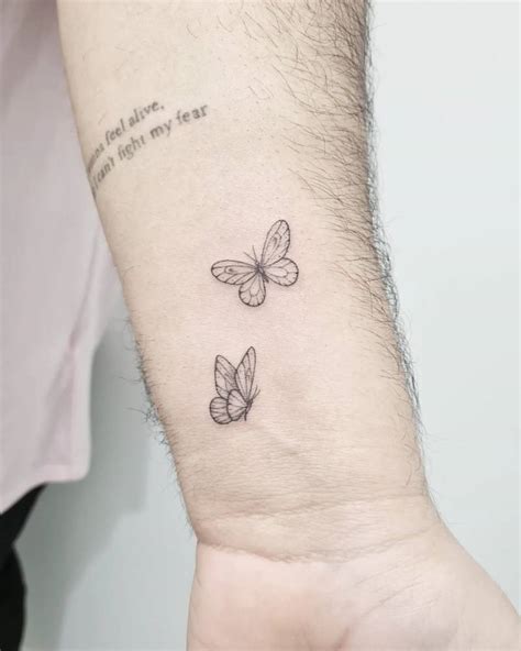 Fine Line Style Butterfly Couple Tattoo Located On The