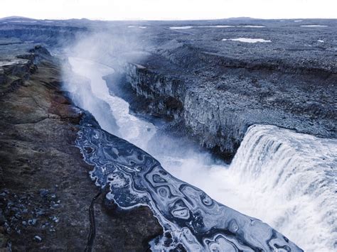 A large waterfall with a river running through it photo – Nature Image ...