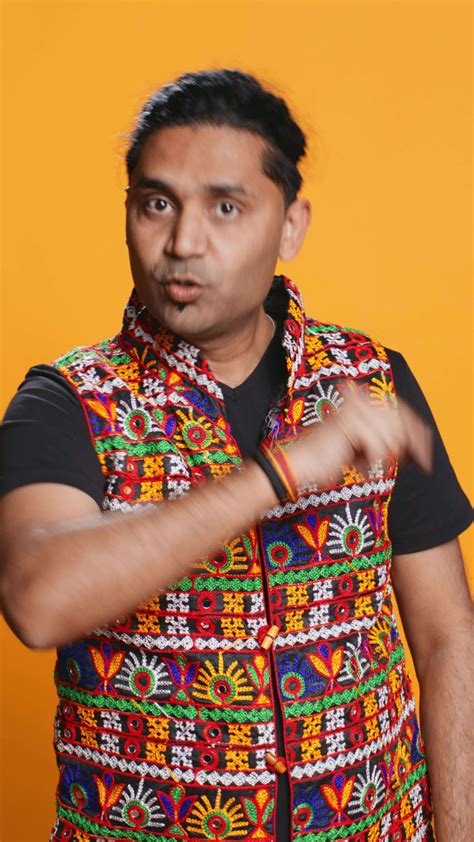 Vertical Authoritative man doing shushing hand gesturing, demanding