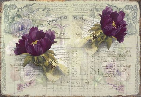 Two Purple Flowers Sitting On Top Of A Piece Of Paper With Writing In