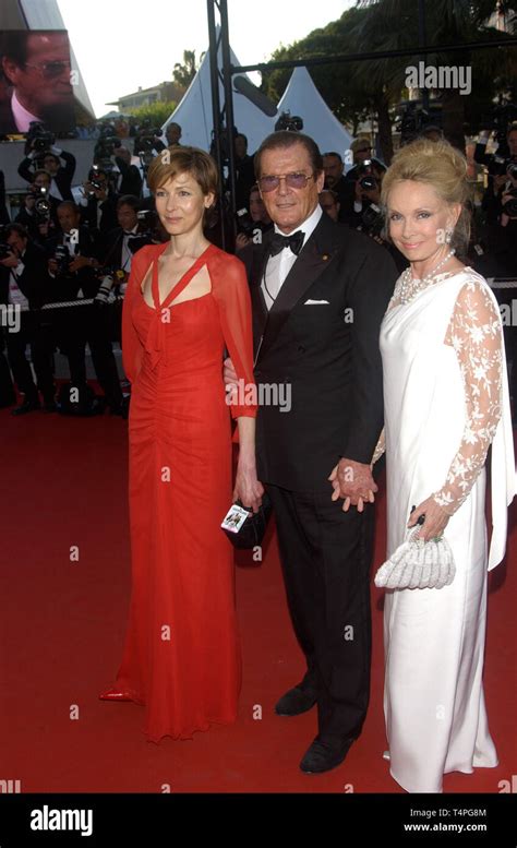 CANNES, FRANCE. May 18, 2004: Actor SIR ROGER MOORE & daughter actress ...