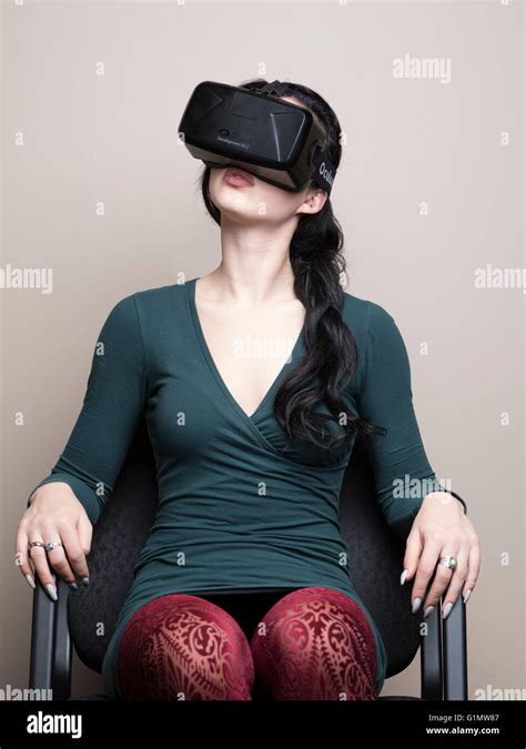 Young Woman Wearing Augmented Reality Oculus Rift Virtual Reality